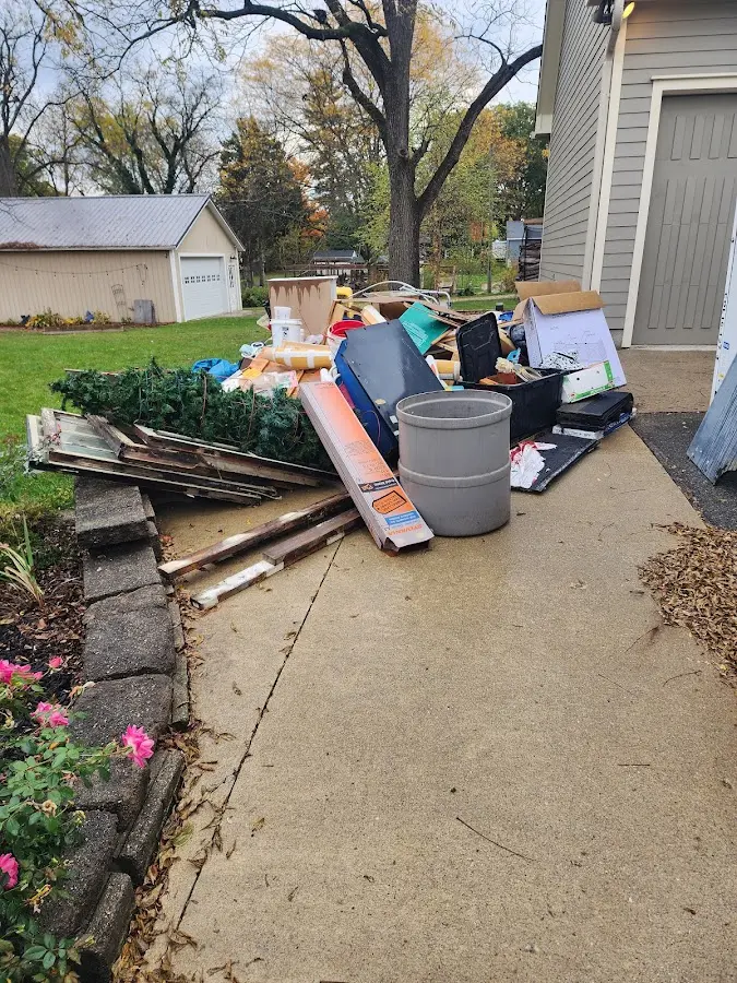 Dumpster being loaded with debris for Commercial Dumpster Rental in North Potomac